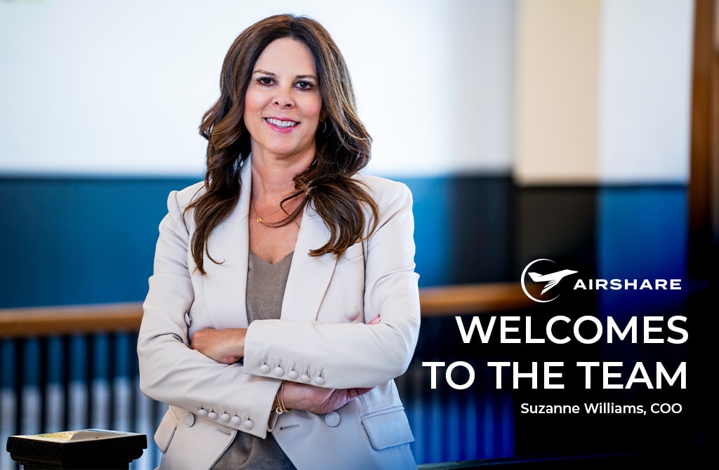 WelcomeToTheTeam_SuzanneWilliams-1024x576-1 Headshot of Suzanne standing in building lobby. Headline reads: Airshare Welcomes To The Team - Suzanne Williams, COO
