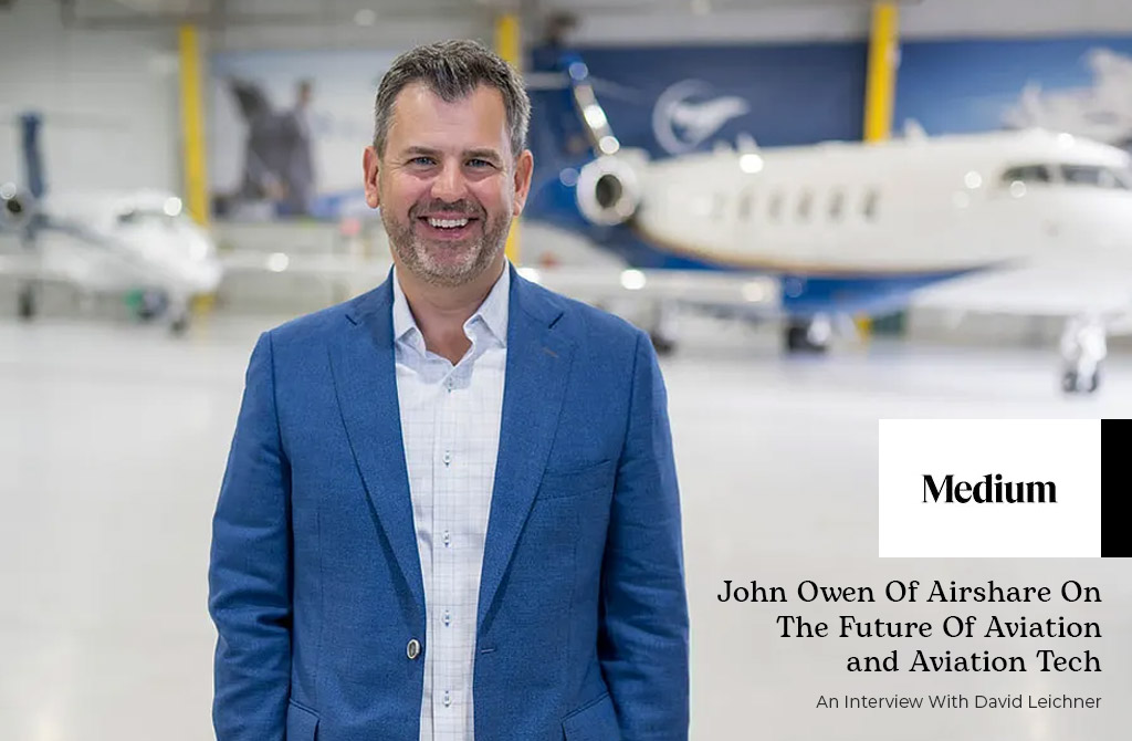 Airshare CEO, John Owen standing in one of the companies FBOs with fleet aircraft on display in the background. Title: Medium - John Owen of Airshare on the Future of Aviation and Aviation Tech - an interview with David Leichner