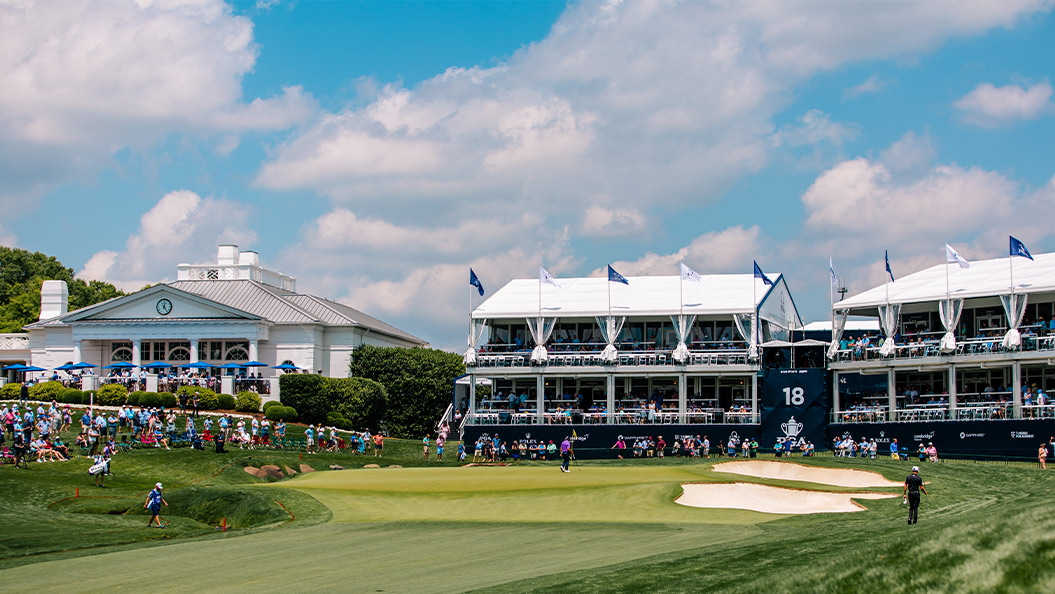 Landscape Photo of the PGA Championship in 2025 with the club house and grand stands in the background with the 18th hole front and center.