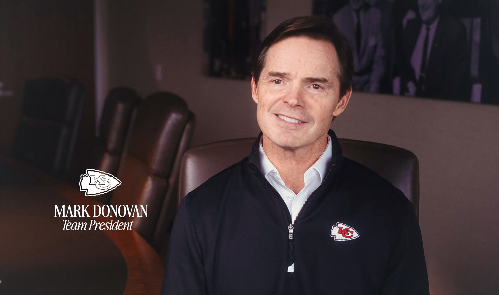 Mark Donovan sitting in a Kansas City Chiefs facility.<br />
Headlins Reads: Chiefs Logo - Mark Donovan, Team President
